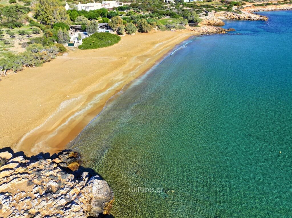 Aerial coastline photo of Faraggas Beach, Paros, with a long sandy shore and crystal clear water.