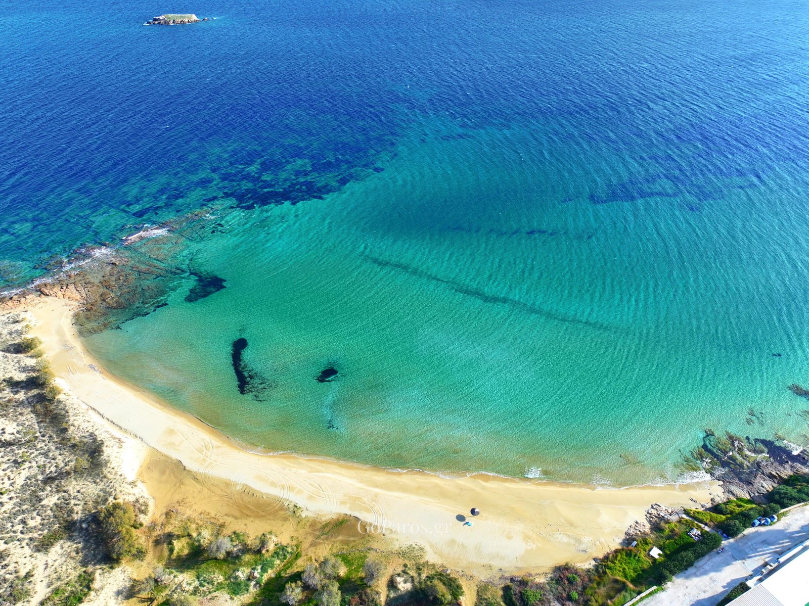 Aerial view of New Golden Beach cove and turquoise water, Paros