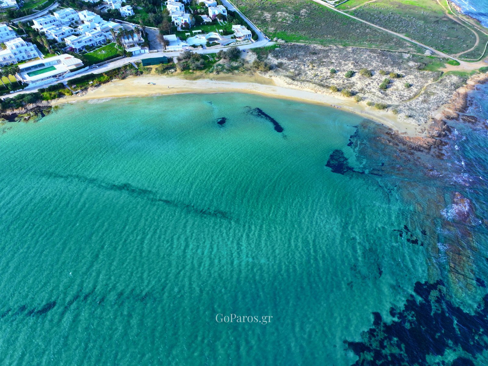 Wide drone view of New Golden Beach bay and shoreline, Paros