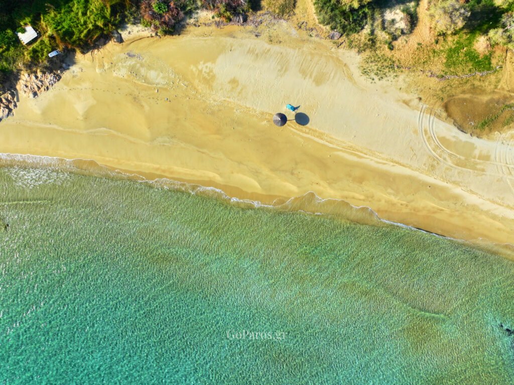 Top down drone shot of umbrellas on New Golden Beach, Paros