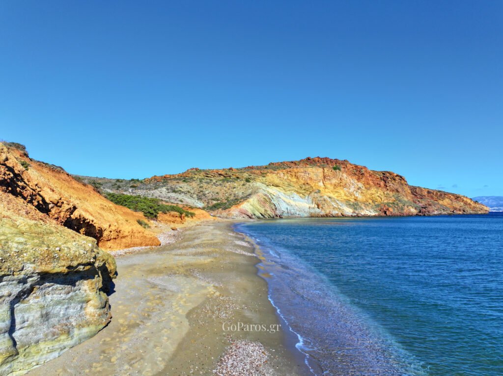High aerial view of Kalogeros Beach in Paros showing the full bay and surrounding hills.
