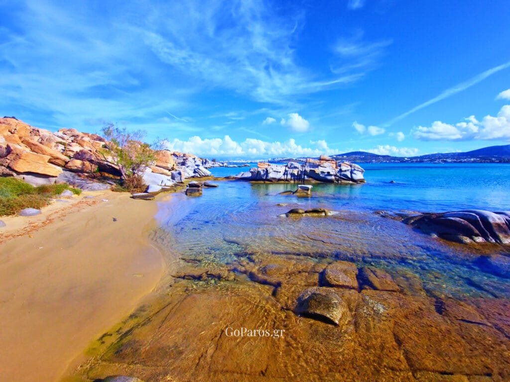 Wide bay view at Kolymbithres Beach, Paros with rocky coves, calm turquoise water, and distant coastline