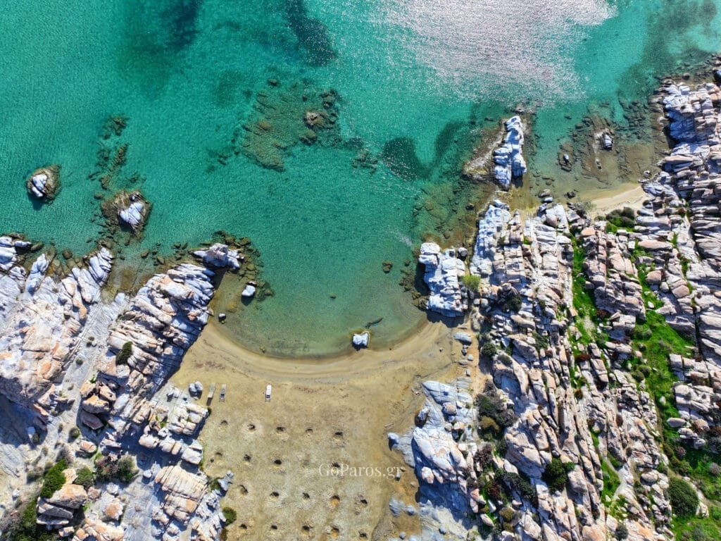 Sandy shoreline at Kolymbithres Beach, Paros with shallow clear water and gentle waves