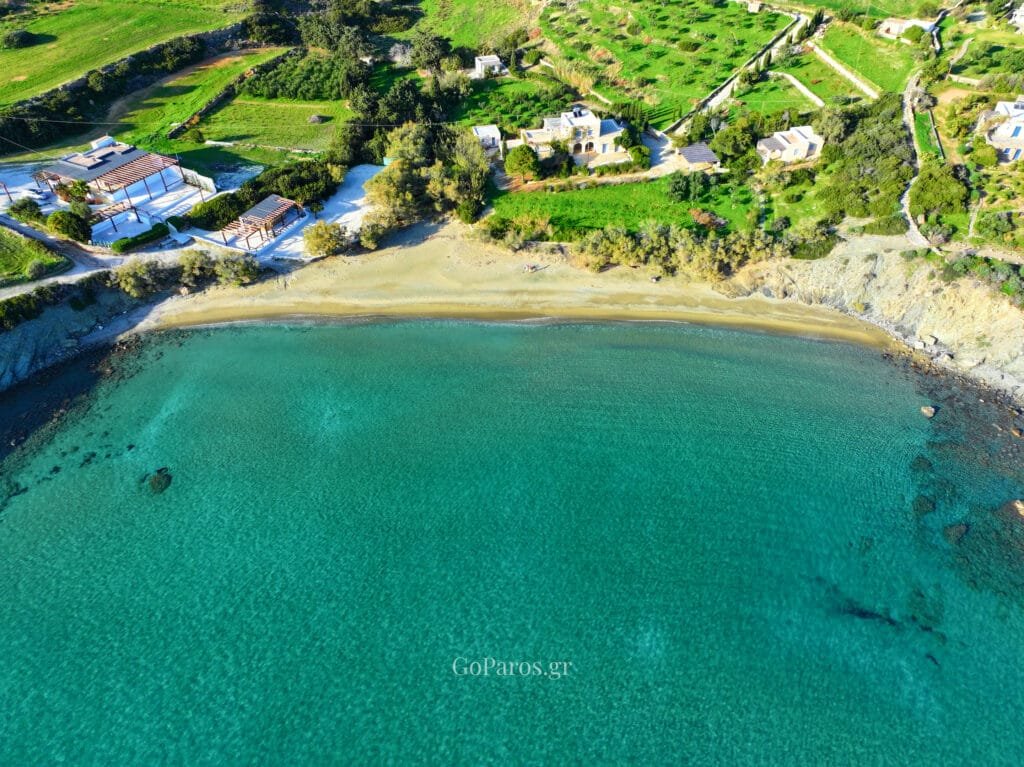 Aerial view near Lolantonis Beach, Paros, and clear turquoise sea.