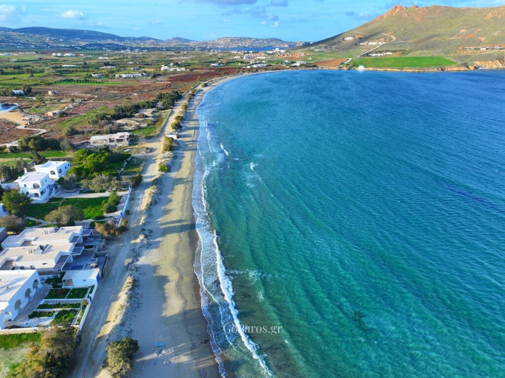 Wide aerial view of Molos Beach bay and coastline, Paros.