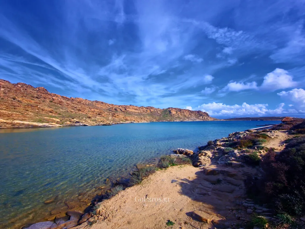 aerial view near monastiri beach in paros, rocky peninsula and turquoise sea