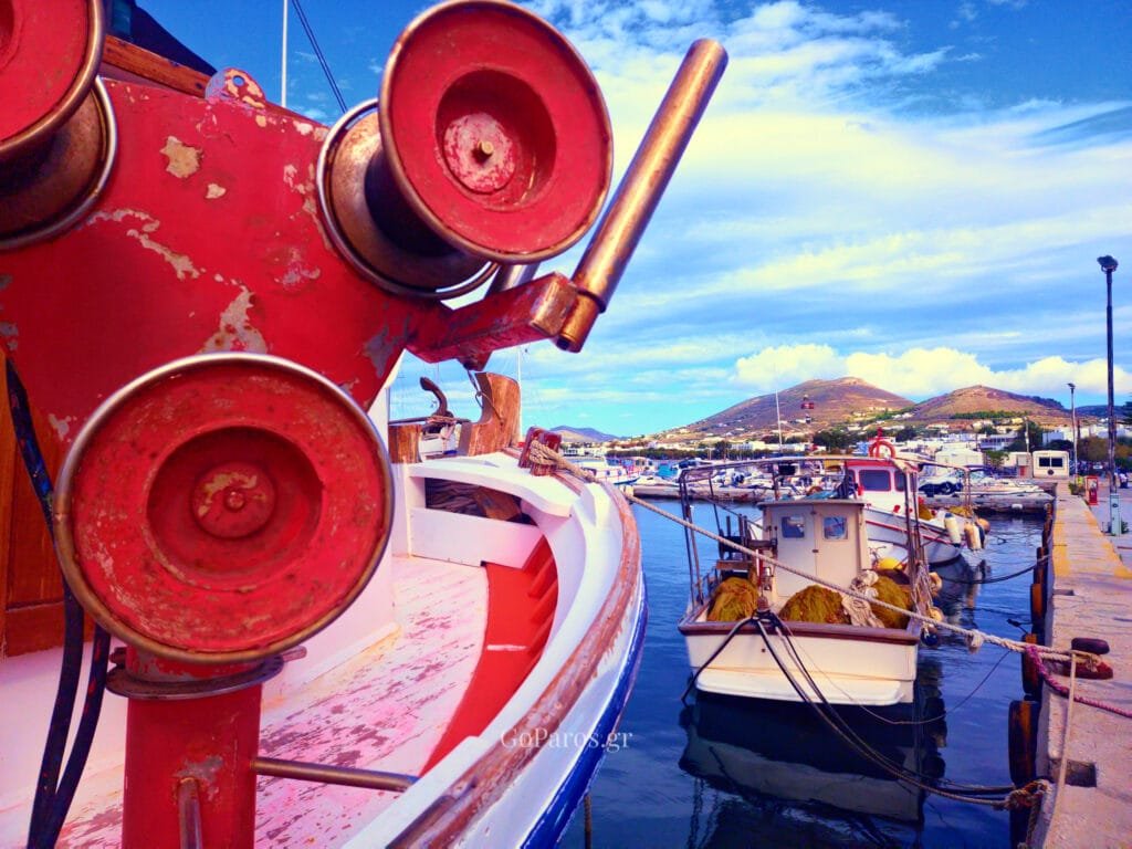 Parikia, Paros, fishing boats at the harbor with red winch machinery in the foreground