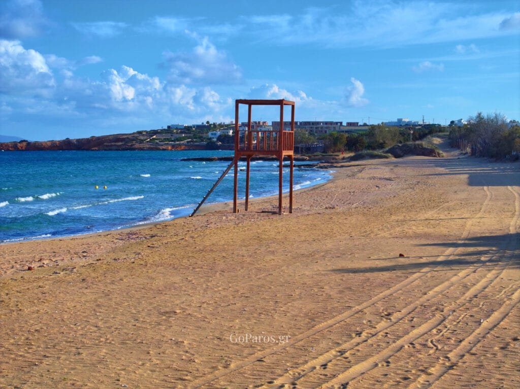 Aerial view of coastal landscape with rocky shore and clear water in Santa Maria beach, Paros