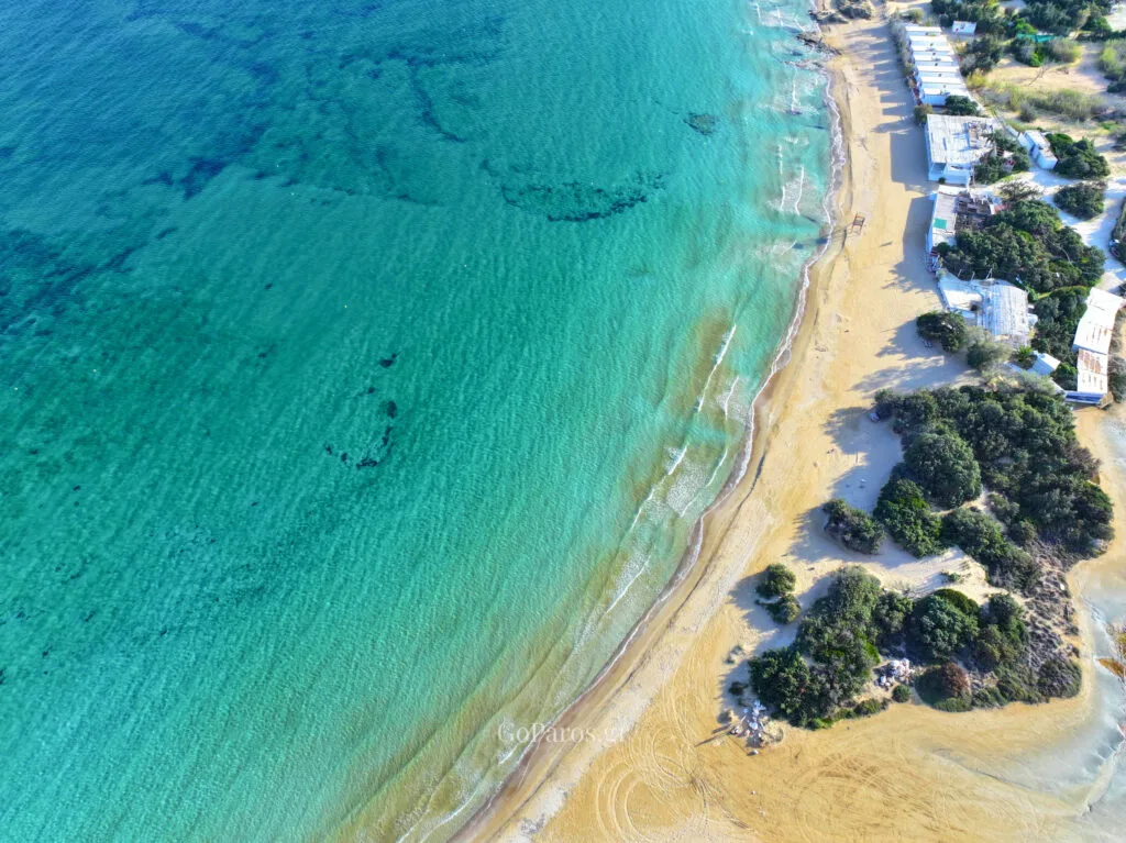 Aerial view of rocky coastline and turquoise sea in Santa Maria, Paros