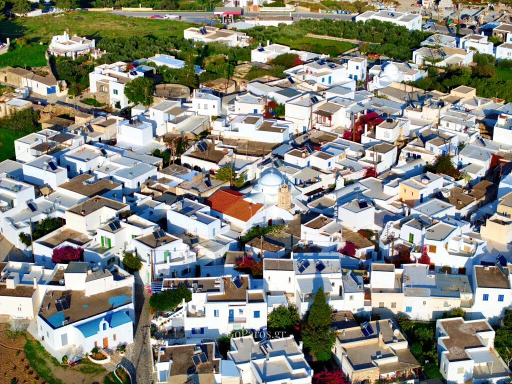 Prodromos, Paros, close aerial view of whitewashed rooftops with a domed church and bell tower