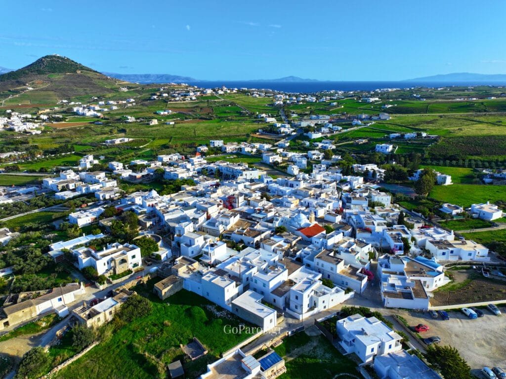 Prodromos, Paros, wide aerial panorama of the village with surrounding countryside, hillside and the sea on the horizon