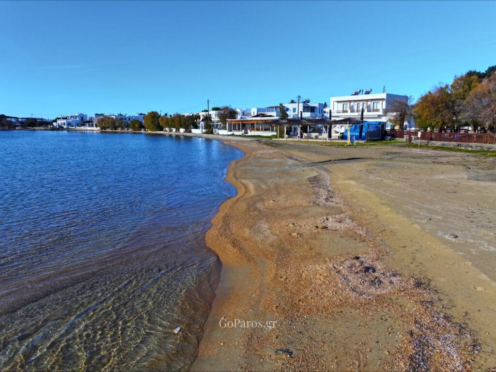Aliki Beach, Paros, shallow clear water along the sandy shoreline with gentle ripples