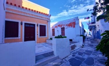 Lefkes, Paros, quiet stone lane with Cycladic houses and warm colored facades