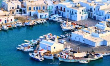 Naoussa Old Port, Paros, aerial view of fishing boats and waterfront buildings