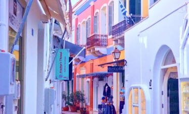Parikia, Paros, colorful street with shops and balconies