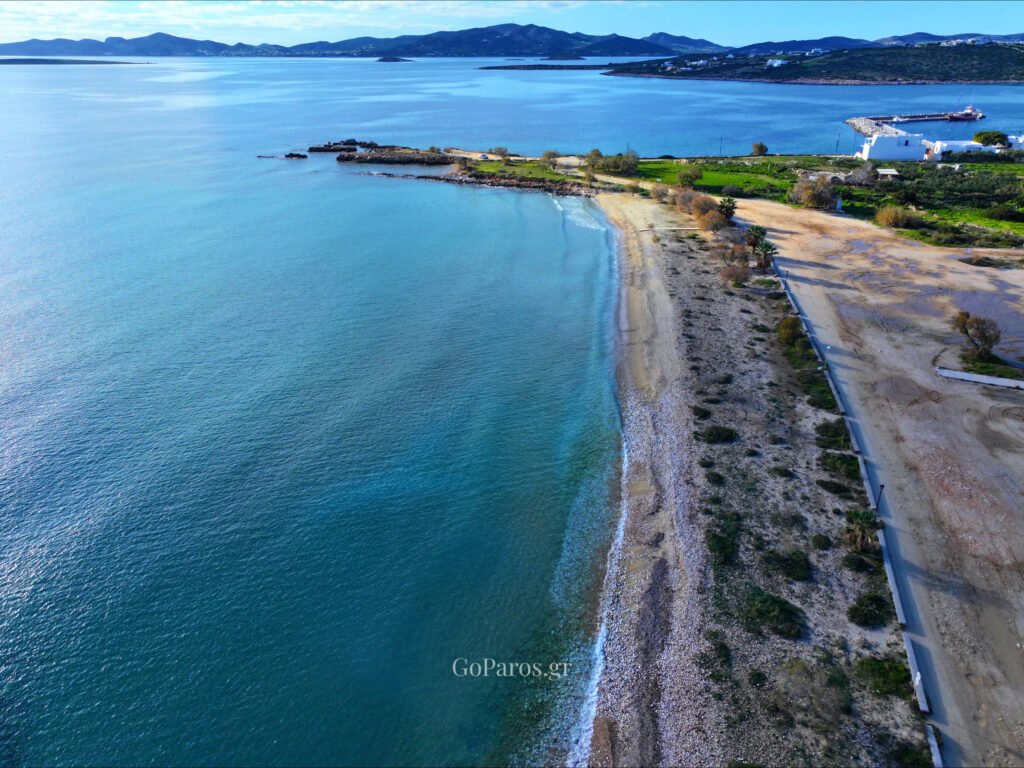 Panoramic coastal view of Piso Aliki Beach Paros with clear waters and mountains in the background