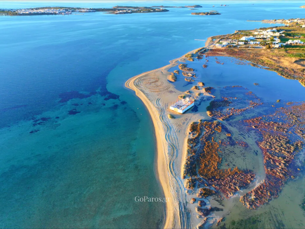 Pounda Beach West, Paros, drone view of sandspit and lagoon with shallow turquoise water