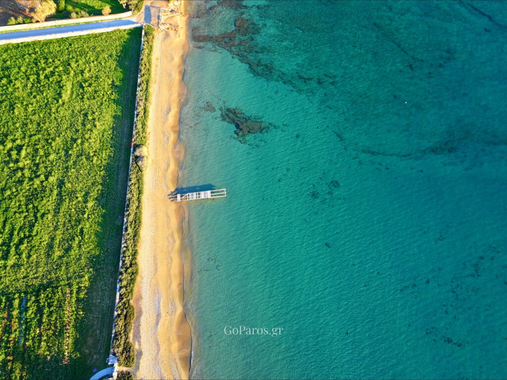 Voutakos Beach, Paros, top-down view of the shoreline with clear shallow water and ripples