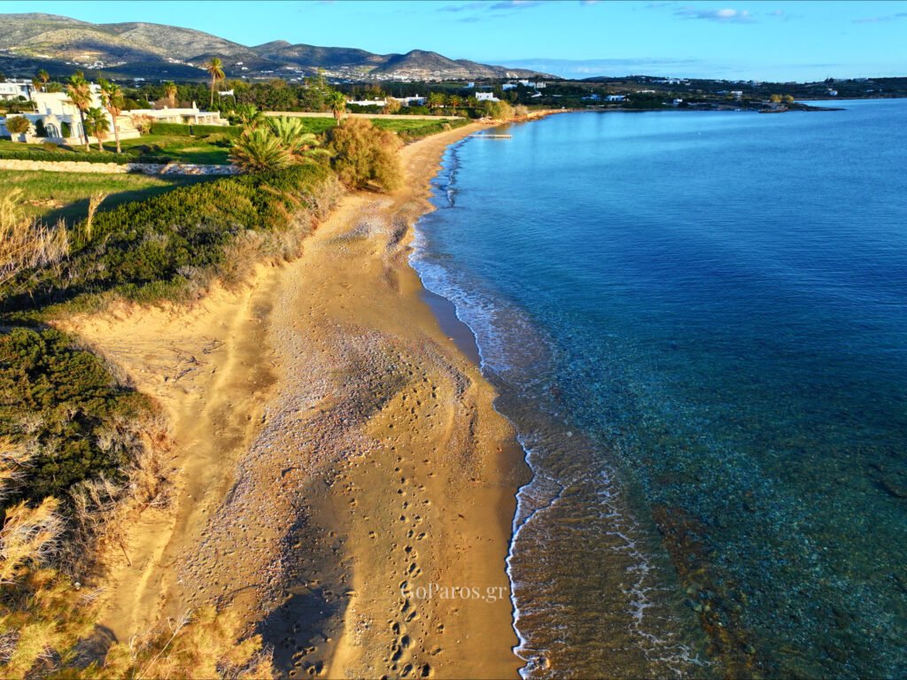Voutakos Beach, Paros, aerial view of the curving sandbar with lagoon water and tracks