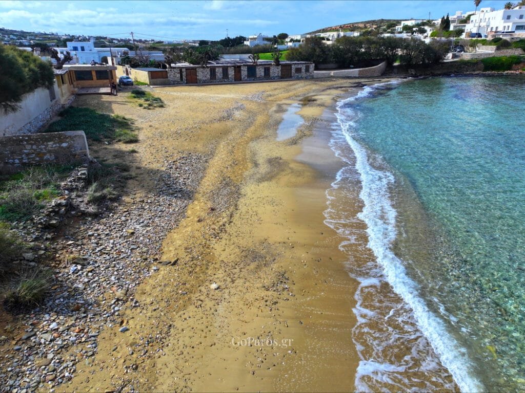 Aerial view of Delfini Beach bay and seafront buildings, Paros.