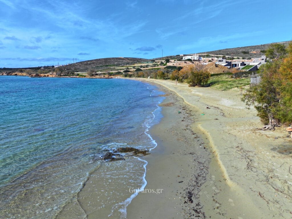 Long sandy shoreline and calm water at Marcello Beach, Paros.