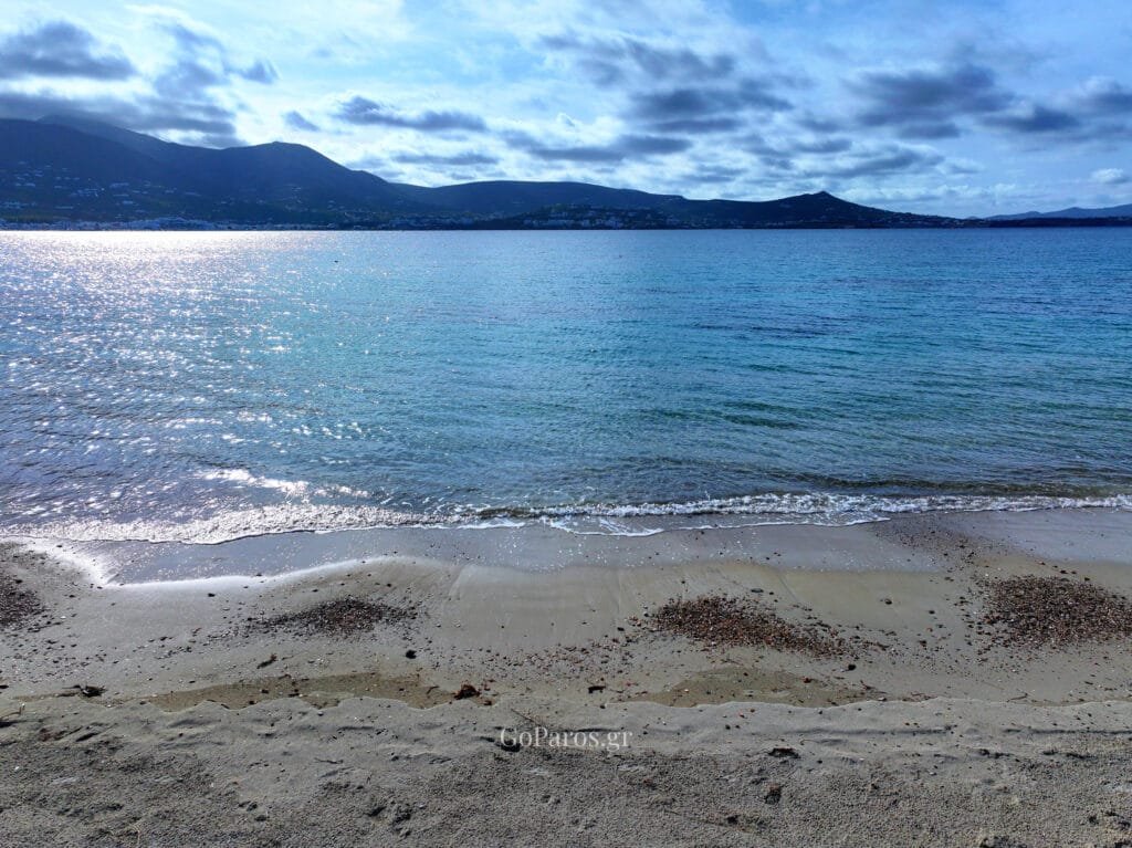 Sea view from the sand at Marcello Beach with distant hills, Paros.