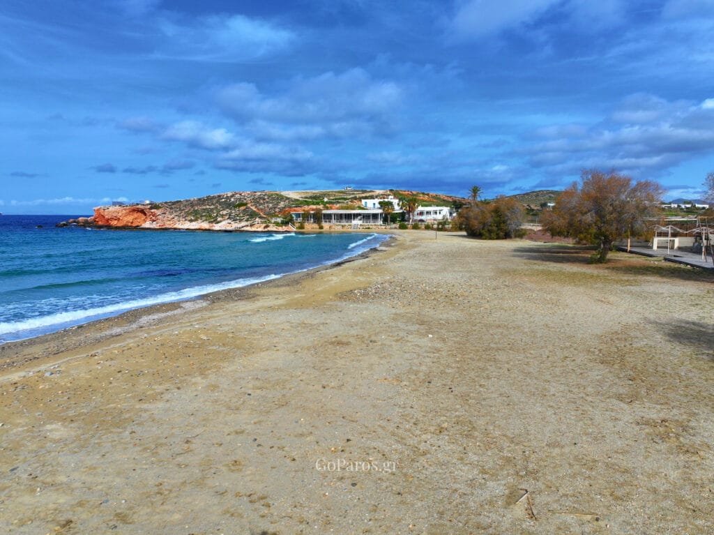 Beachfront view at Parasporos Beach looking toward the rocky headland, Paros.