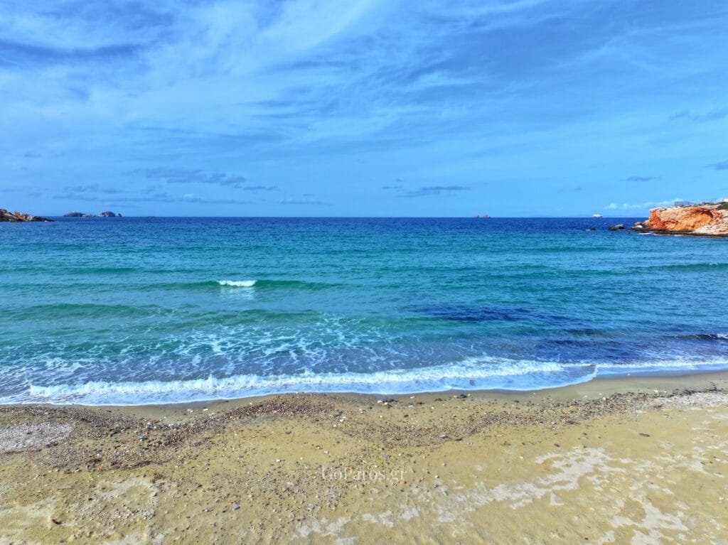 Sea and shoreline view at Parasporos Beach with small waves, Paros.