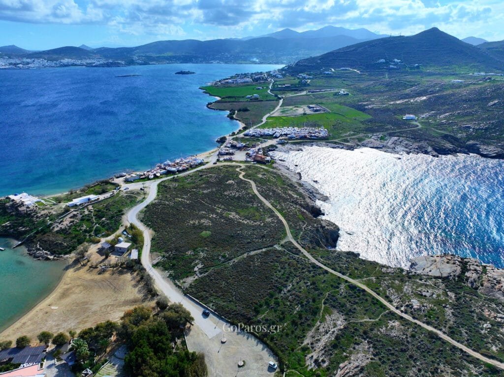 Aerial view of the coastal road and bays near Paros Park, Paros.