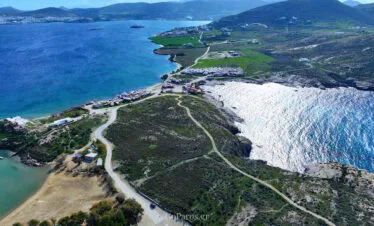 Aerial view of the coastal road and bays near Paros Park, Paros.