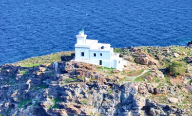 Close-up aerial of the Paros Park lighthouse on the cliffs, Paros.