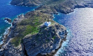 Wide aerial view of the Paros Park lighthouse and peninsula, Paros.