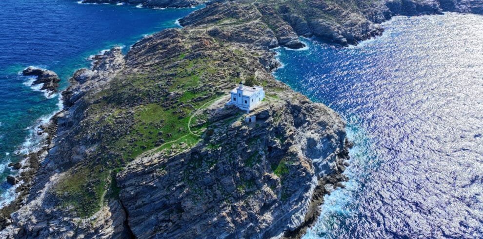 Wide aerial view of the Paros Park lighthouse and peninsula, Paros.
