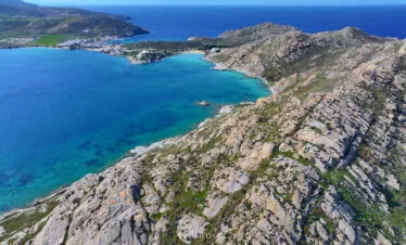 Aerial view of the Paros Park peninsula ridge and turquoise bays, Paros.