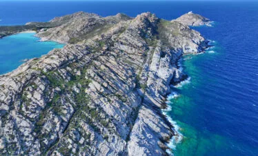 Aerial view of the rocky Paros Park coastline and clear water, Paros.