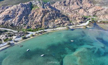 Shallow bay with small boats near Paros Park, Paros.