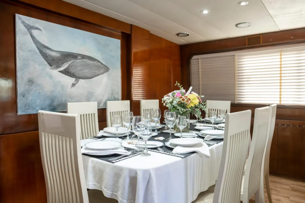 Akhir 27 yacht interior, dining salon set for lunch.