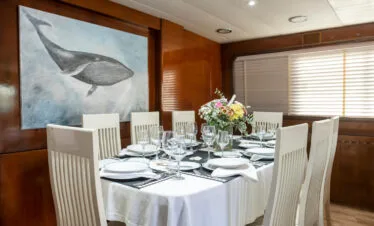 Akhir 27 yacht interior, dining salon set for lunch.