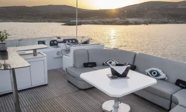 Akhir 27 yacht in Paros, sundeck seating and helm area.