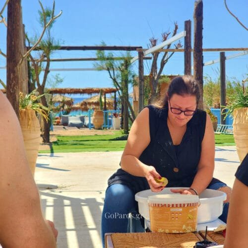 Pottery instructor demonstrating clay preparation during a workshop in Paros