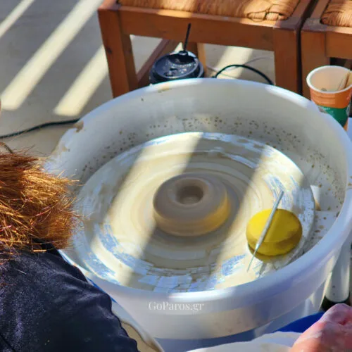 Clay spinning on the pottery wheel during a hands-on workshop in Paros