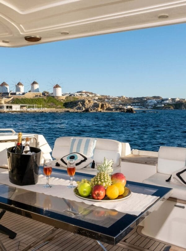 Aft deck cocktails and fruit on a Ferretti 46, private yacht cruise in Paros.