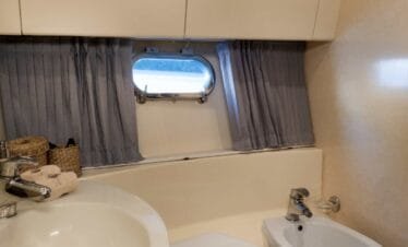 Bathroom on a Ferretti 46 yacht, private yacht cruise in Paros.