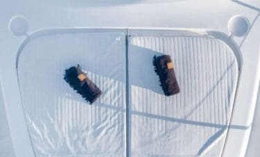 Bow sunpad towels on a Ferretti 46, private yacht cruise in Paros.