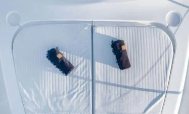 Bow sunpad towels on a Ferretti 46, private yacht cruise in Paros.