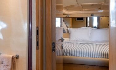 Cabin hallway and master suite on a Ferretti 46 yacht, private yacht cruise in Paros.