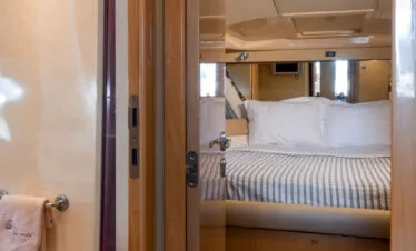 Cabin hallway and master suite on a Ferretti 46 yacht, private yacht cruise in Paros.