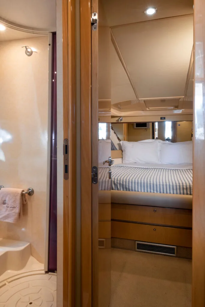 Cabin hallway and master suite on a Ferretti 46 yacht, private yacht cruise in Paros.