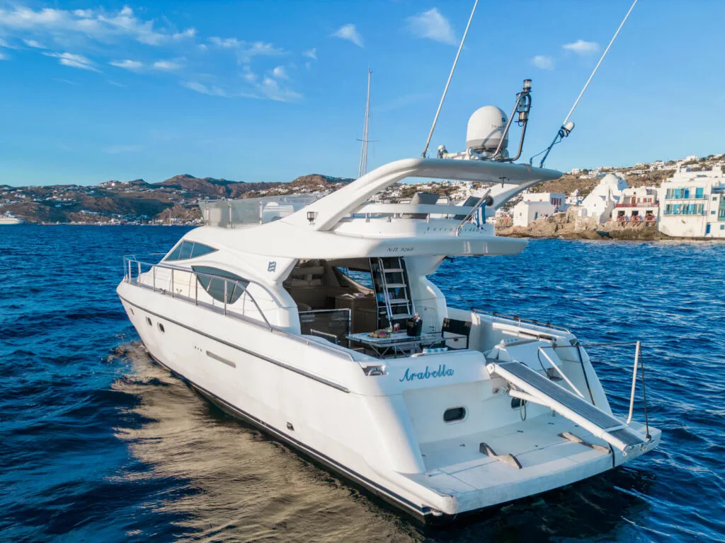 Ferretti 46 yacht near Mykonos windmills, private yacht cruise from Paros.