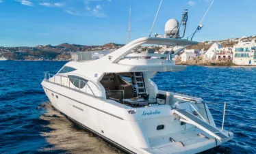 Ferretti 46 yacht near Mykonos windmills, private yacht cruise from Paros.